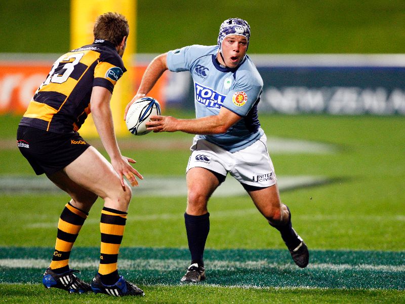 Tim Dow playing rugby